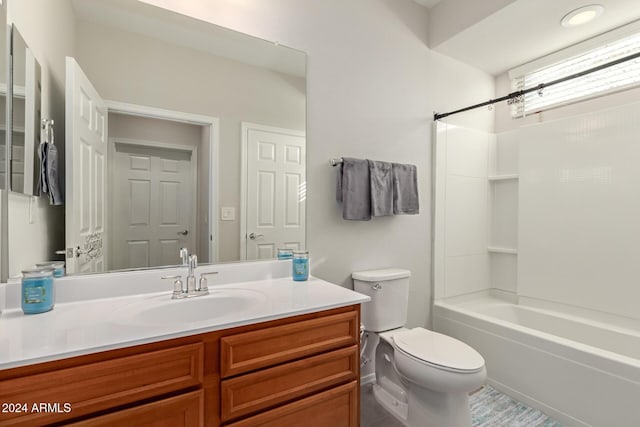 full bath featuring toilet, washtub / shower combination, and vanity