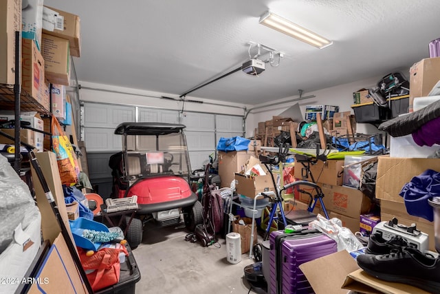 garage featuring a garage door opener