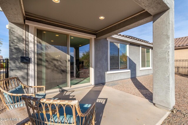 view of patio featuring fence