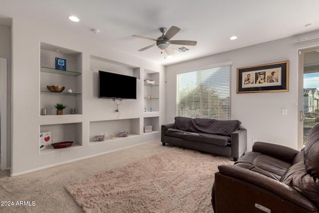 living area featuring visible vents, built in features, a ceiling fan, carpet flooring, and recessed lighting