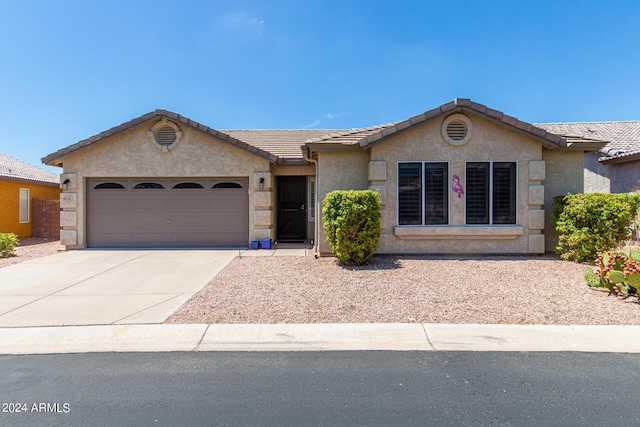 ranch-style home with a garage