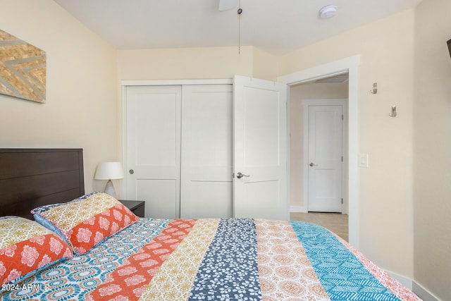 bedroom with a closet and light tile patterned floors