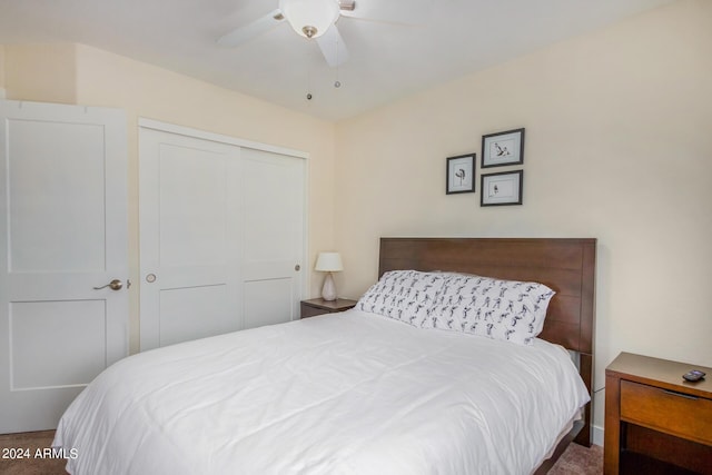 bedroom with ceiling fan and a closet