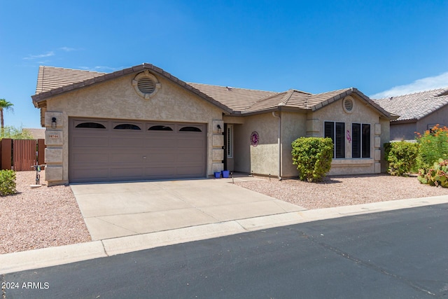 ranch-style home with a garage