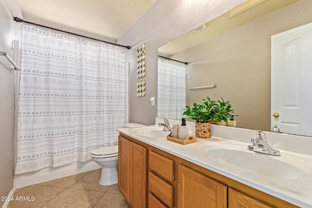 full bathroom featuring tile patterned floors, vanity, shower / bath combo, and toilet