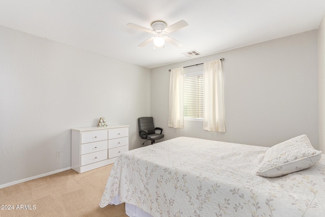 bedroom featuring light colored carpet and ceiling fan