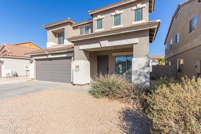 view of front of property with a garage