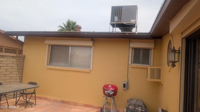 962 S Main Dr, Apache Junction, AZ 85120 - view of home's exterior with cooling unit and a patio