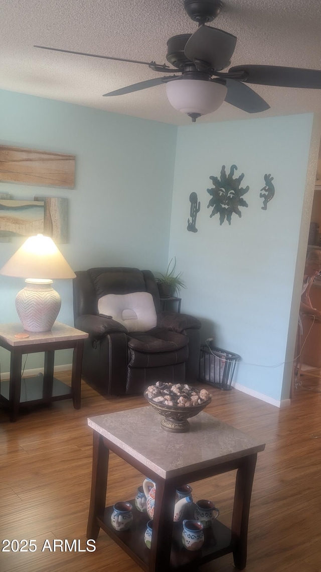 962 S Main Dr, Apache Junction, AZ 85120 - sitting room featuring wood finished floors, ceiling fan, baseboards, and a textured ceiling