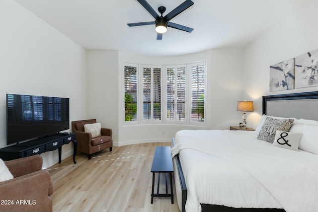 bedroom with ceiling fan and light wood-type flooring