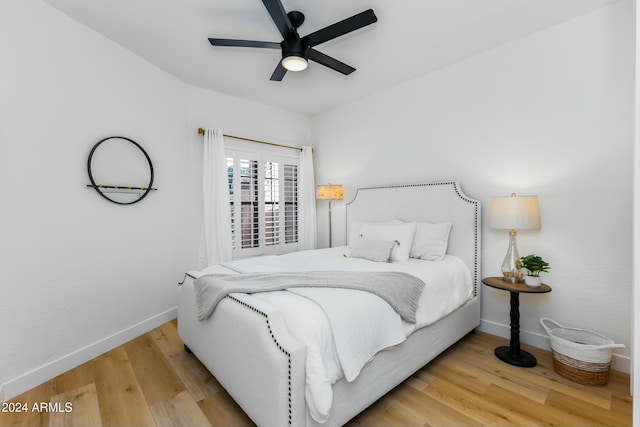 bedroom featuring wood-type flooring and ceiling fan