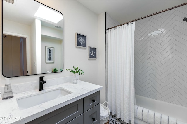 bathroom with vanity and shower / bathtub combination with curtain