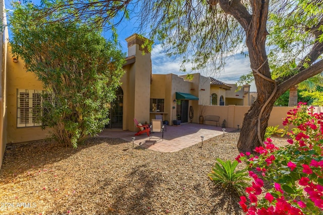 rear view of property featuring a patio