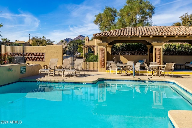 view of swimming pool featuring a patio area