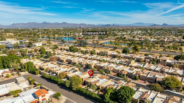 bird's eye view with a water and mountain view