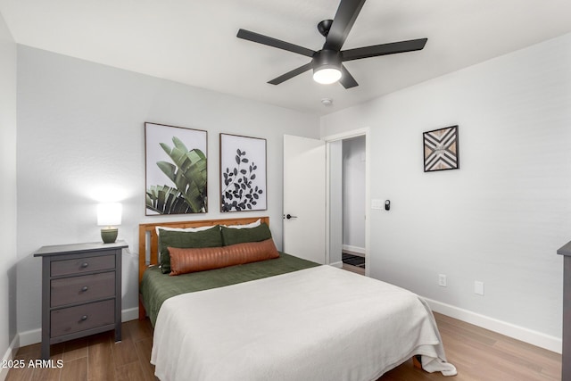 bedroom featuring ceiling fan and hardwood / wood-style floors