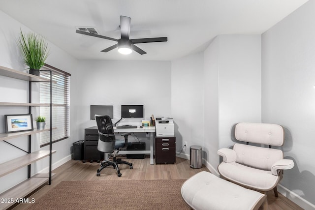 office with ceiling fan and light wood-type flooring