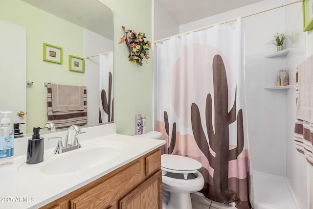 bathroom featuring toilet, vanity, curtained shower, and tile patterned flooring