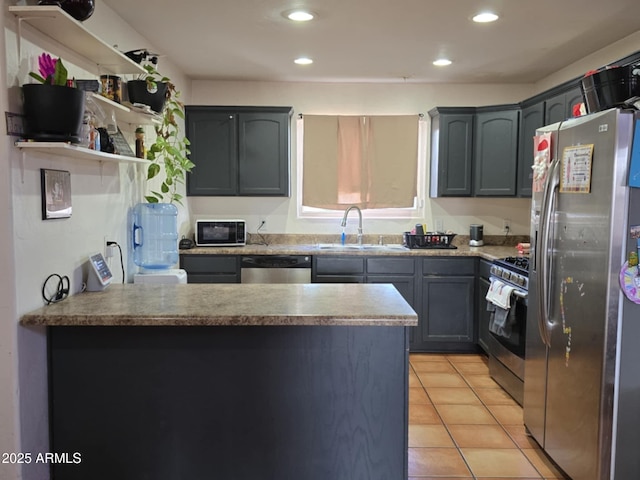 4207 N Santa Fe Ave, Douglas, AZ 85607 - kitchen featuring recessed lighting, light tile patterned floors, a sink, a peninsula, and appliances with stainless steel finishes