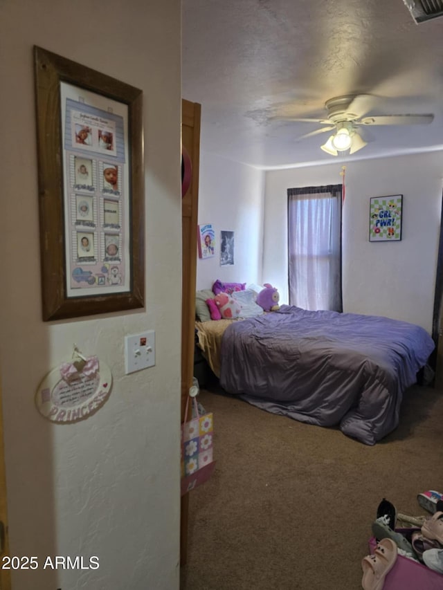 4207 N Santa Fe Ave, Douglas, AZ 85607 - bedroom with carpet floors, a ceiling fan, and visible vents