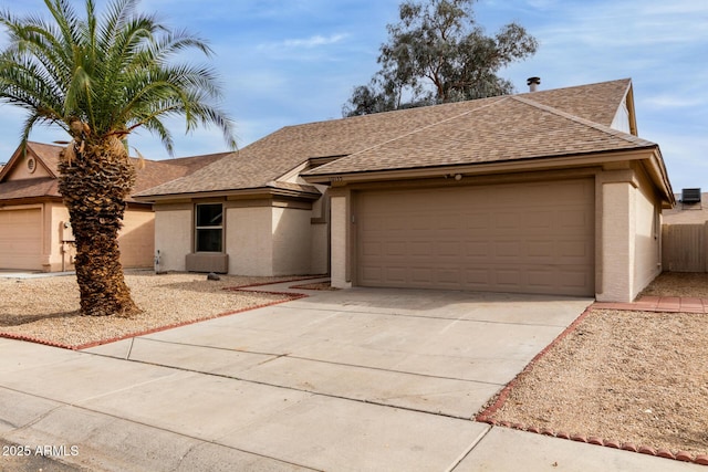 ranch-style home with a garage, driveway, roof with shingles, and stucco siding