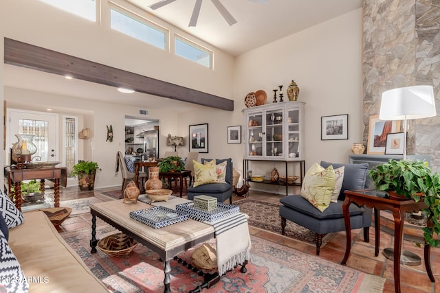 living room with plenty of natural light and ceiling fan