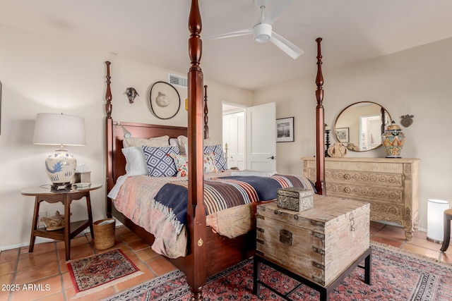 tiled bedroom featuring ceiling fan