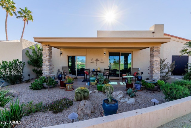 back of house featuring a patio area