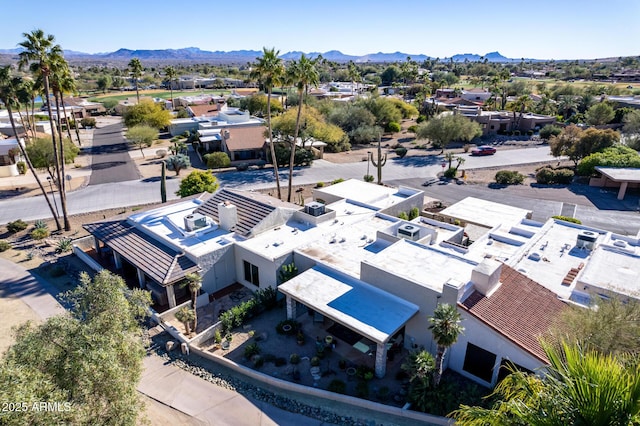 birds eye view of property featuring a mountain view