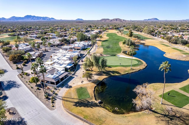 birds eye view of property with a water and mountain view