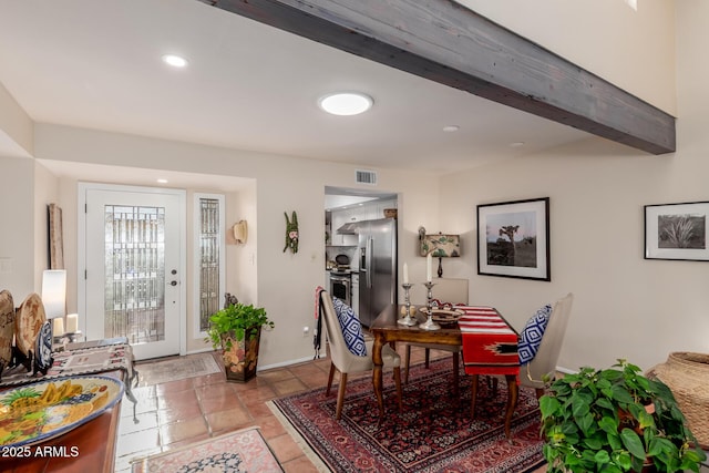 dining room featuring beam ceiling