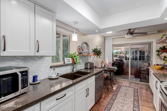 kitchen with white cabinets, sink, and appliances with stainless steel finishes