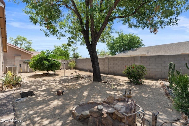 view of yard with central air condition unit, a patio, and a fenced backyard