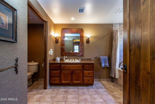 bathroom with tile patterned flooring and an enclosed shower