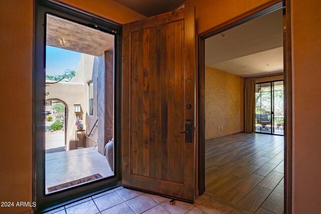 bathroom with tile patterned flooring, shower / bath combination with curtain, and vanity