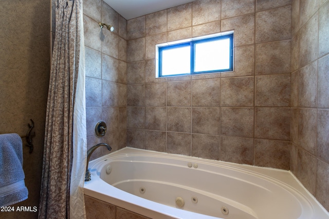 bathroom featuring shower / bathtub combination with curtain