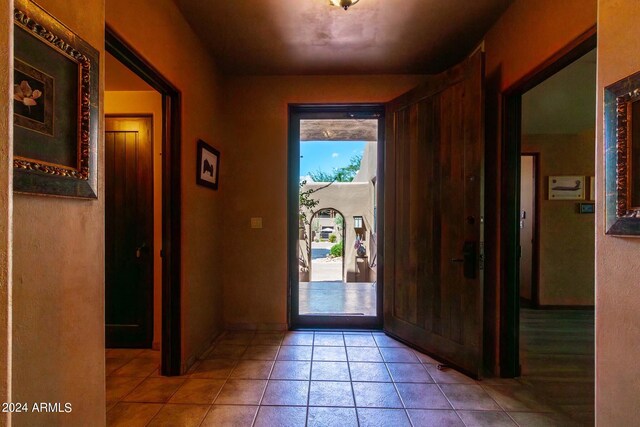 entryway featuring light tile patterned floors