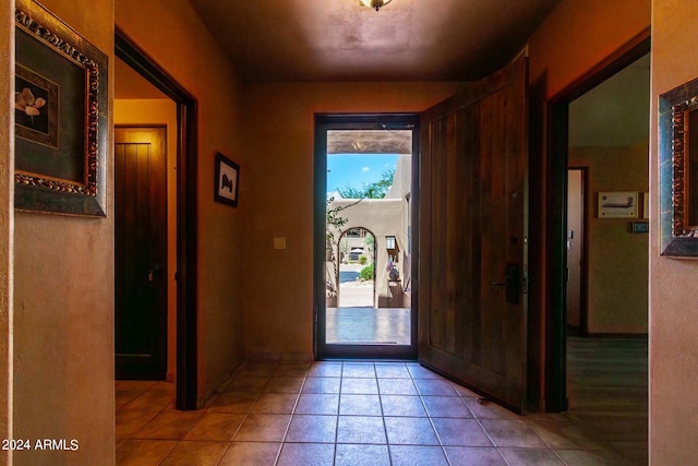 entryway featuring light tile patterned flooring