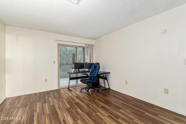 office space featuring dark hardwood / wood-style floors and a textured ceiling