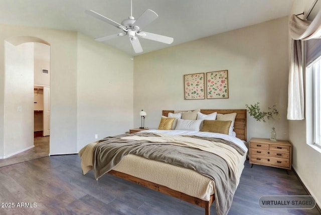 11664 W Eagle Ct, Surprise, AZ 85378 - bedroom featuring lofted ceiling, wood finished floors, arched walkways, and multiple windows