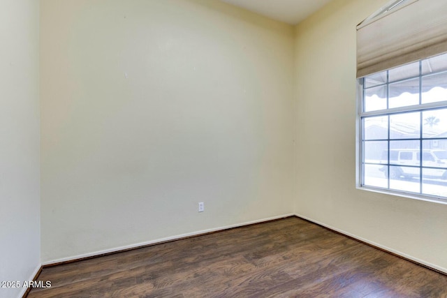 11664 W Eagle Ct, Surprise, AZ 85378 - spare room with baseboards and dark wood-style flooring
