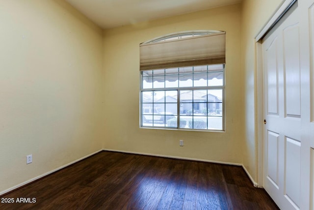 11664 W Eagle Ct, Surprise, AZ 85378 - spare room with dark wood-type flooring and baseboards