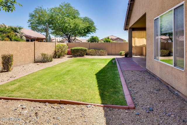 11664 W Eagle Ct, Surprise, AZ 85378 - view of yard with a fenced backyard and a patio