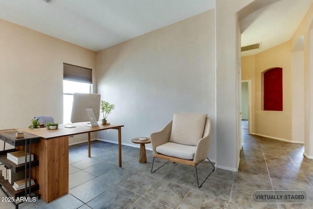 11664 W Eagle Ct, Surprise, AZ 85378 - tiled office featuring visible vents, baseboards, and arched walkways