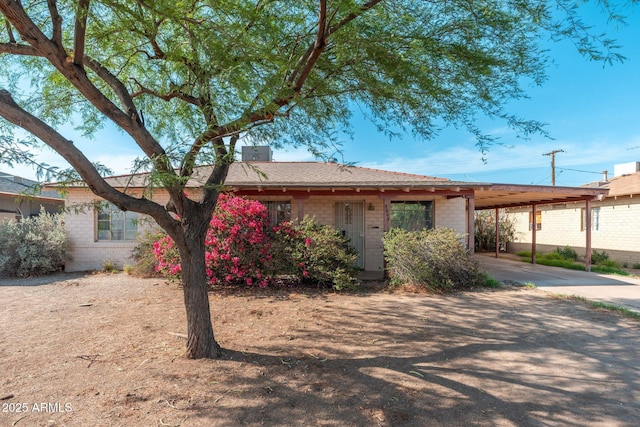 2002 W Whitton Ave, Phoenix, AZ 85015 - ranch-style house with an attached carport, driveway, and brick siding