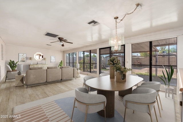 2002 W Whitton Ave, Phoenix, AZ 85015 - dining area featuring a chandelier, wood finished floors, and ceiling fan