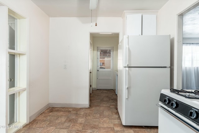 2002 W Whitton Ave, Phoenix, AZ 85015 - kitchen with white appliances, stone finish floors, white cabinets, and a ceiling fan