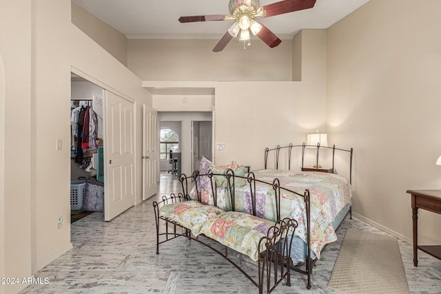 bedroom with ceiling fan and a closet