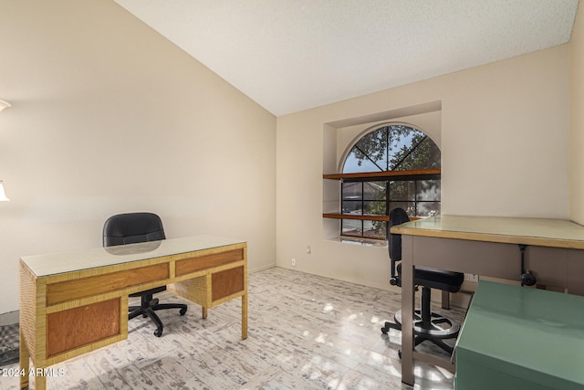 office featuring a textured ceiling and lofted ceiling