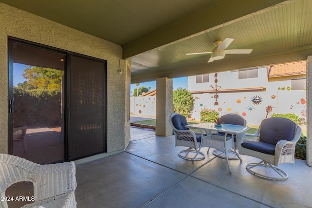 view of patio featuring ceiling fan